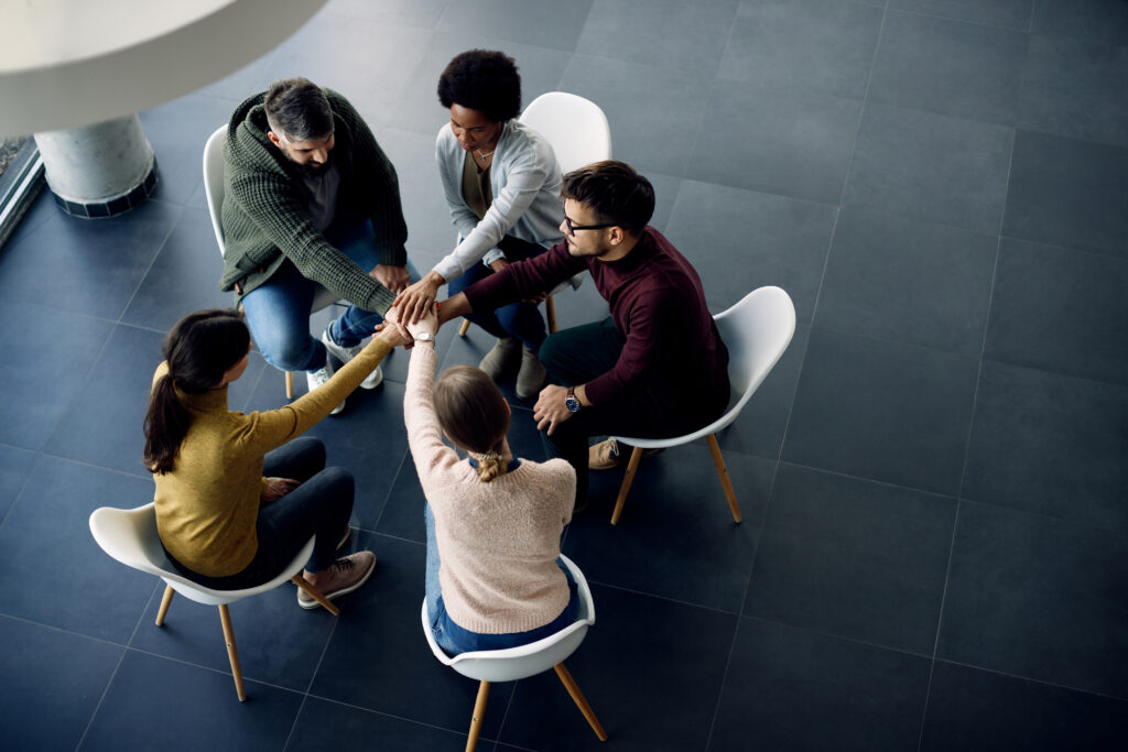 View Group Therapy Participants Holding Hands Unity Meeting 1024x683